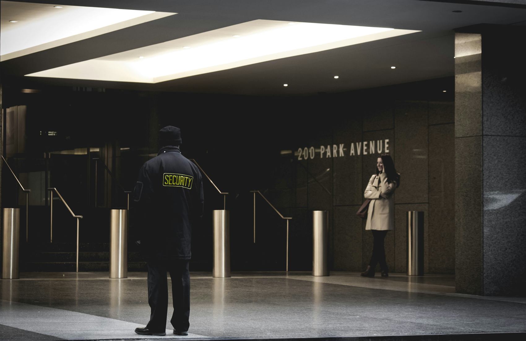 Security guard at a building entrance